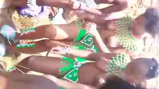 African girl takes a selfie with her busty topless friends