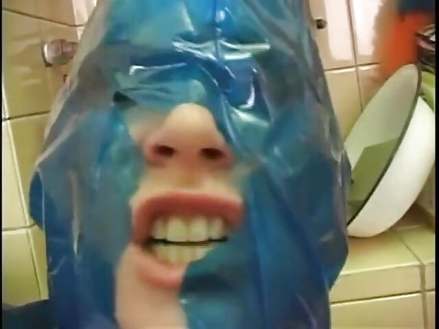 Latex chick enjoys in anal bathroom smash