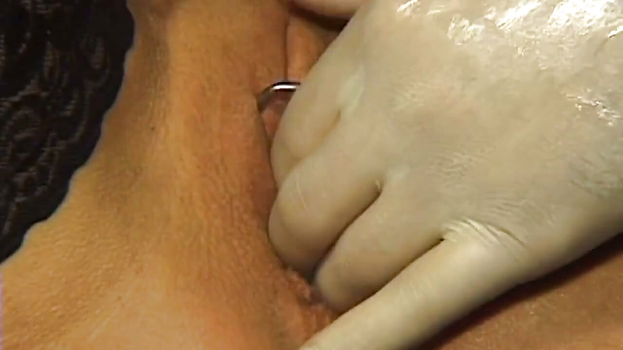 Chained Mature Beauty Receives Deep Gloved Fisting