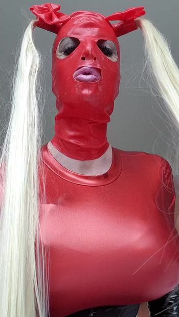 Sissy bimbo fucktoy in red waiting to service cocks