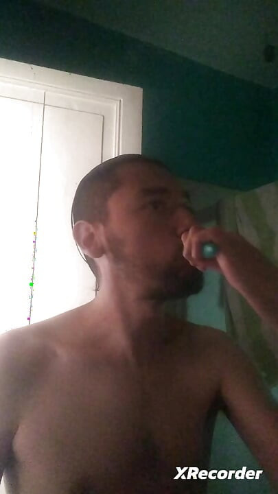 Man does his skincare in the morning