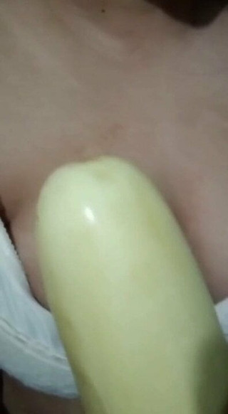 Horny girl sucking cucumber