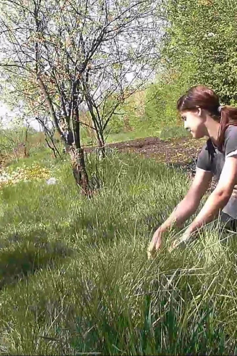 Pissing in grass on the side of the road