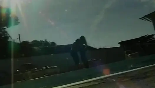 Petite blonde lesbians having fun by the pool