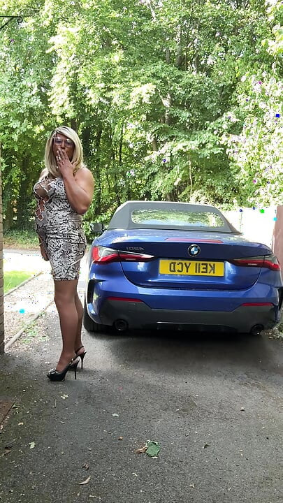Sexy Crossdresser kellycd2022 in white animal print dress pantyhose and heels