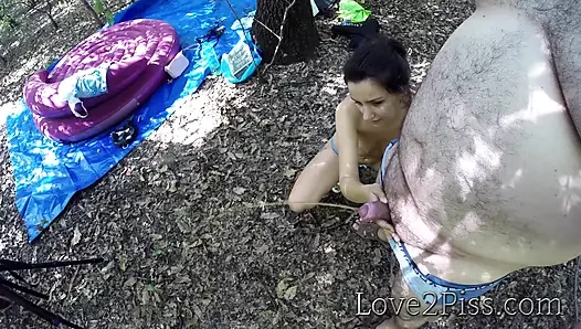 Sexy young girl helps old man empty his bladder by holding his cock