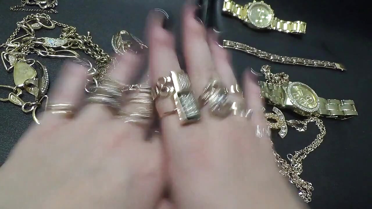 Golden jewelry and hand fetish