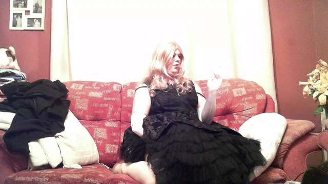 Tink Toll in gown smoking