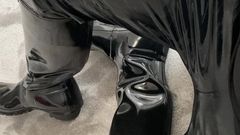 Guy in shiny pvc pants and gloss hunter boots