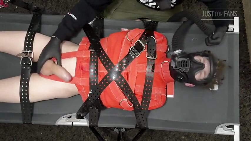 Bondage Twink Strapped to Campbed in Straitjacket and Gas Mask
