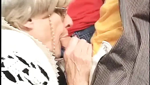 Horny granny knows pretty well how to handle gang bang