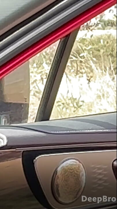 Redhead deepthroats thick BBC in the car, fingers gripping tight