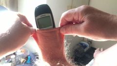 Three minutes of foreskin stretch in sunlight: phone