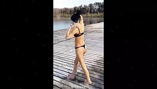 Babe in skimpy black thong undies jumps into a lake (fail)