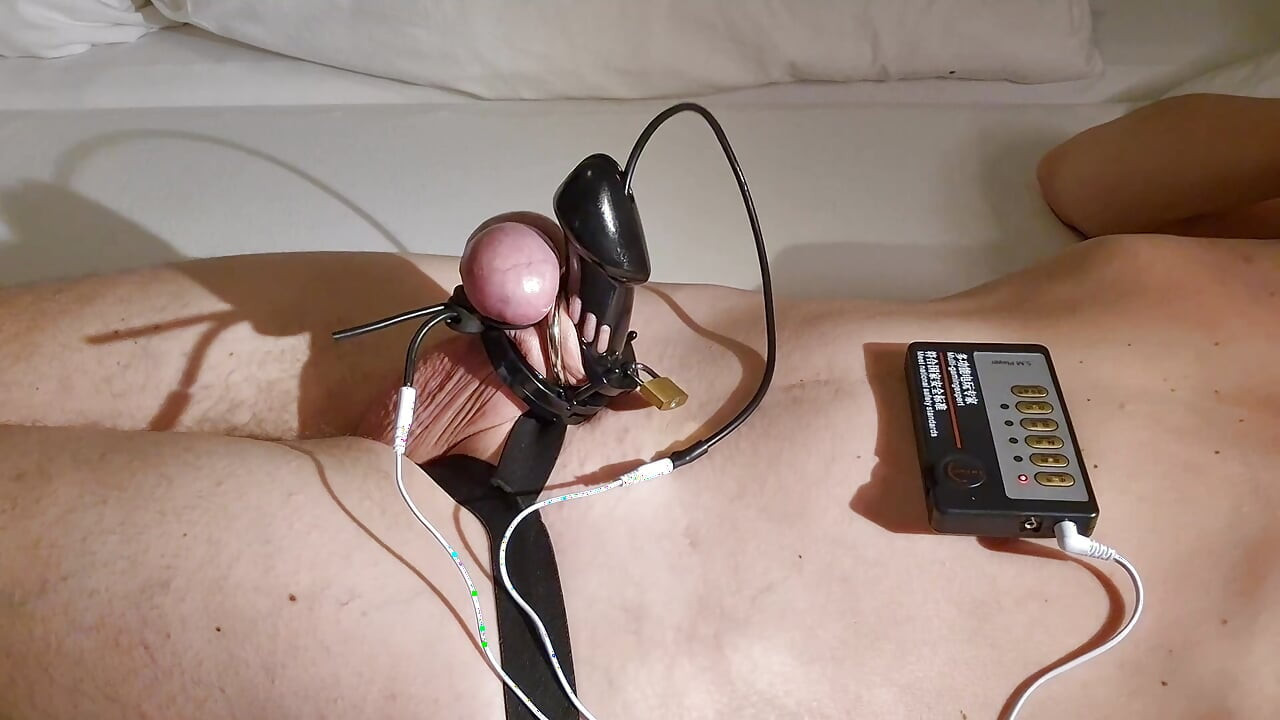 Tied up with penis cage and tormented with Estim