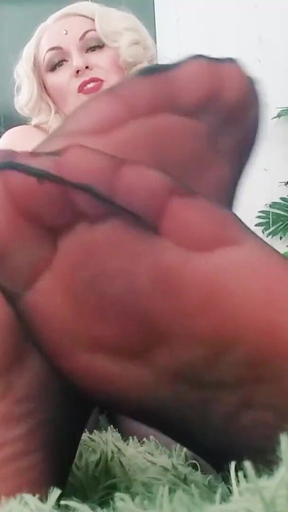 Emotional moment from "Foot Fetish Video: sexy black NYLON feet. Dominant hot blonde MILF Arya Grander"
