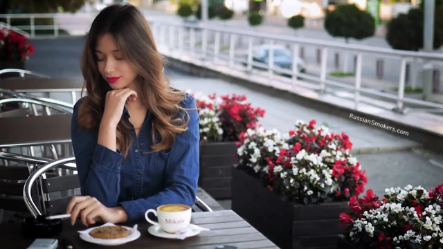 Magnetic Russian Beauty Playing with Cigarette Smoke
