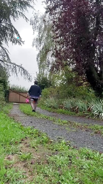 Dressed in a little pink plaid skirt for a party