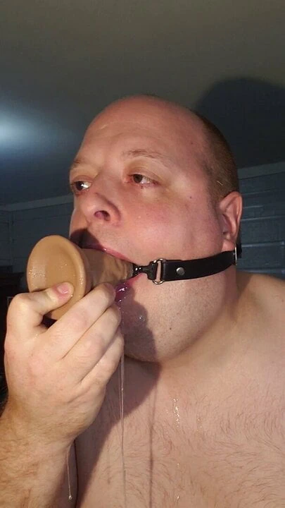 Slideshow mouth gag dildo.
