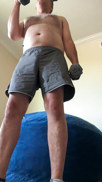 Lifting weights with my shirt off. My big sexy hairy chest is out in full force