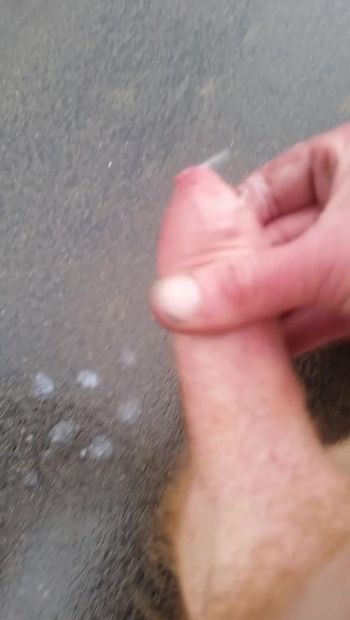 Wanking my cock stood on the road naked cum flows from my willy onto the tarmac