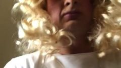 Tranny goes blonde and toys with lightsaber
