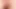The boy slathers oil on his big foreskin-covered penis, stretching the skin back and forth.