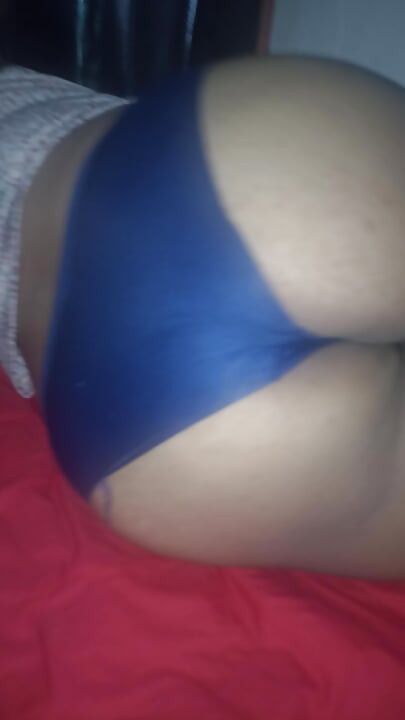 Chubby wife shows her buttocks on the bed