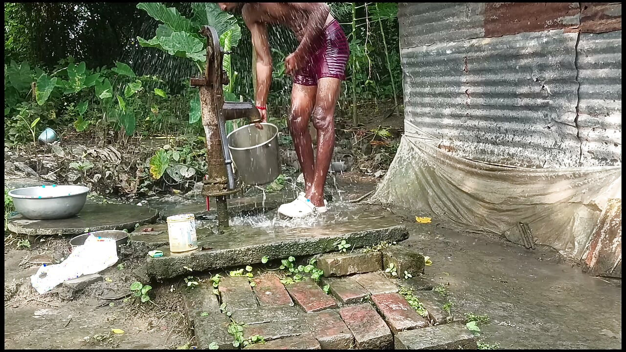 Black mature man bath in desi style. Showing big dick.