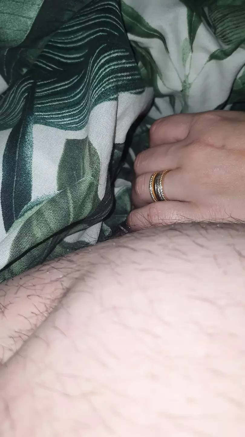 Step mom hand slip under blanket touching step son dick and handjob him