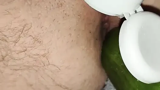 My wife is fucking my ass with a huge cucumber.