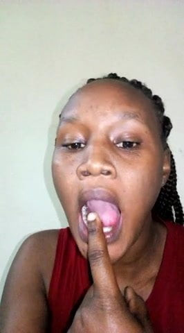 African girlfriend licking her finger