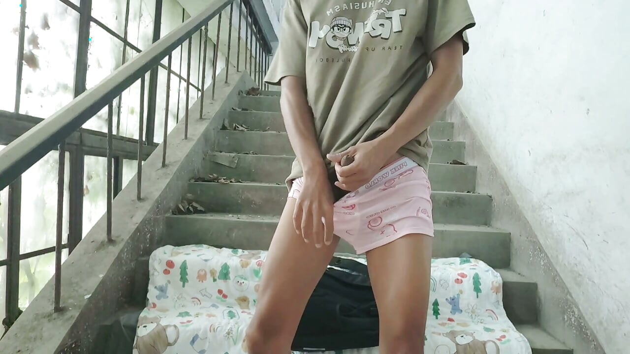 Cute Asian boy enjoys a wonderful time by ejaculating and consuming semen in the ruined stairwell on the eve of his birthday