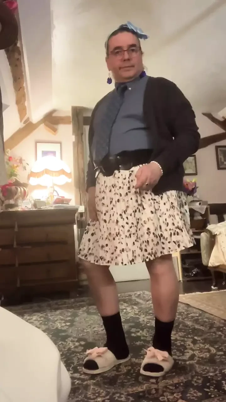 Dressed with a shirt and tie and a skirt with feminine underwear for a night out