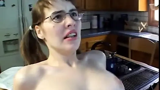 Hot young brunette takes a load on her glasses after getting ass fucked
