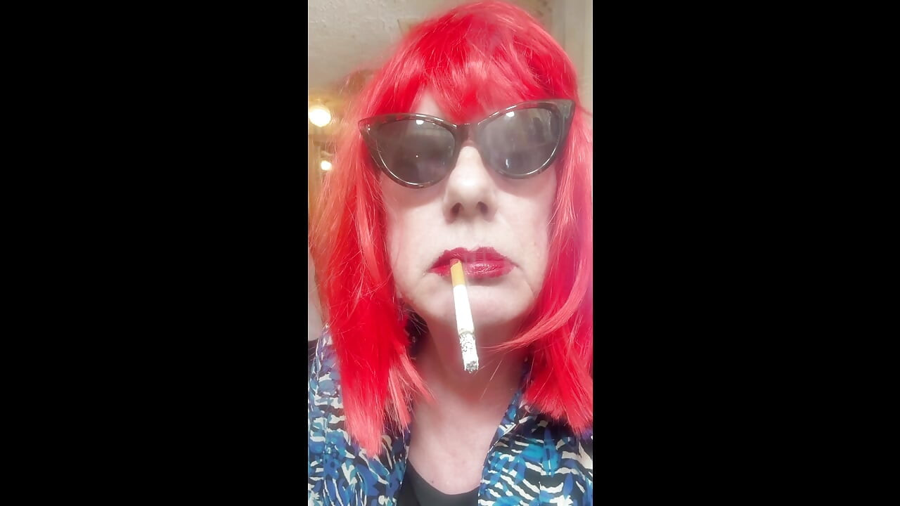 MRS. ROMAN DESTROYING A MARLBORO 100 MENTHOL CLOSE UP - WITH DANGLING AND NOSTRIL EXHALES