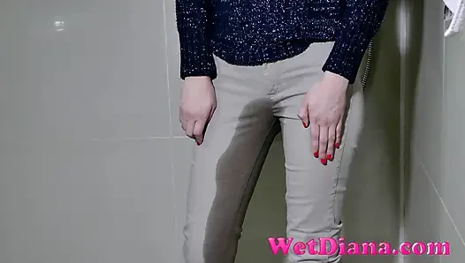Jeans button stuck, she has to pee in her pants