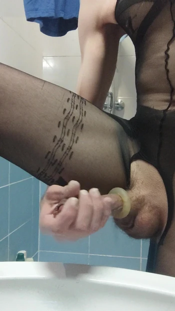 Young boy jerks off dick in nylons, jerks off in the bathroom