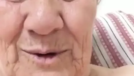 An old woman shows herself