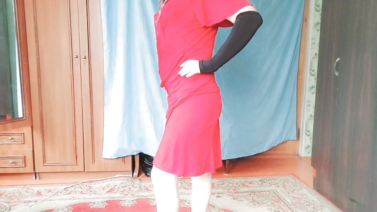 Stunning trans beauty enjoying warm sunlight by balcony
