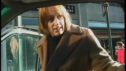 Commuter redhead carpools with creep who debases her in car in city traffic