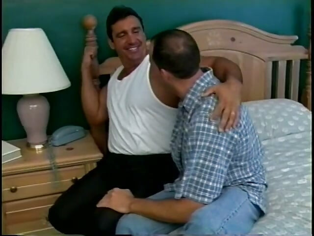 Two male lovers blow each other in a hotel room