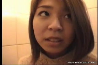 Cute Asian babe foddling with her pussy