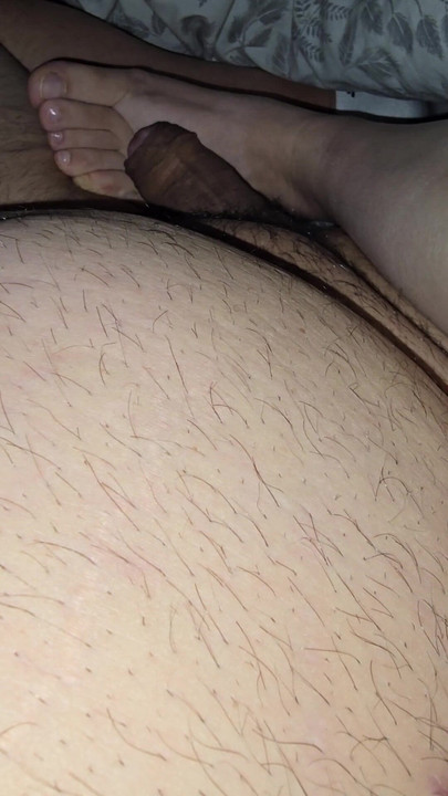 Step mom lets step son fuck her feet while sitting in bed | Clip 1