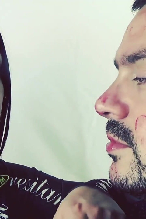 Covering Alex with red shiny lipstick kisses all over his face!