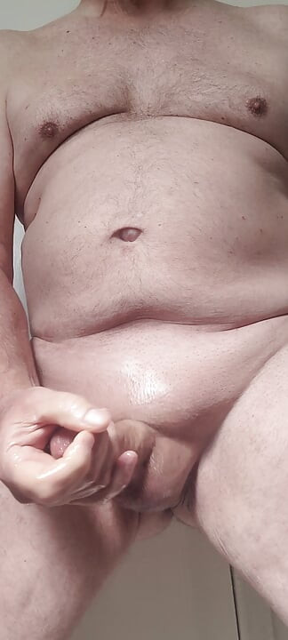 Solosexual strokes my shaved, oiled up cock to get a load of cum to swallow