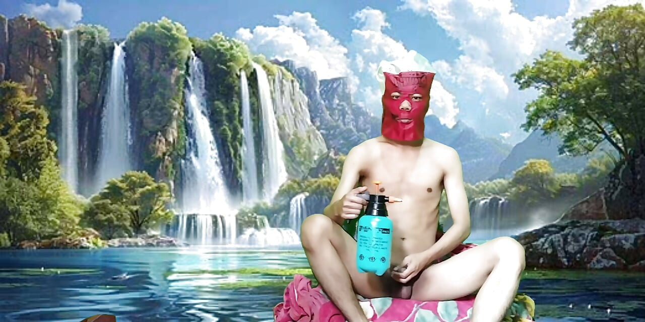 Masturbating with a dildo made from a bottle, used under a waterfall.