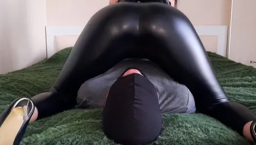 Ass worship. Facesitting. Dominatrix Nika sits on her slave's face with her sexy ass in leggings. Femdom face seat.
