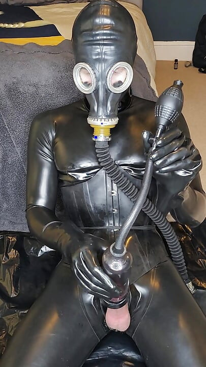 Latex doll training, gasmask, cock pump, plugged