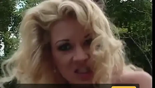 Two horny studs taking turns to fuck a busty blonde outdoors
